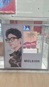 Sticker Print display branding Molsion eyewear di kaca toko optik mall Bali
