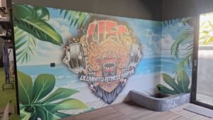Sticker Print wallpaper mural logo Uluwatu Fitness Center bermotif Barong Bali di dinding gym